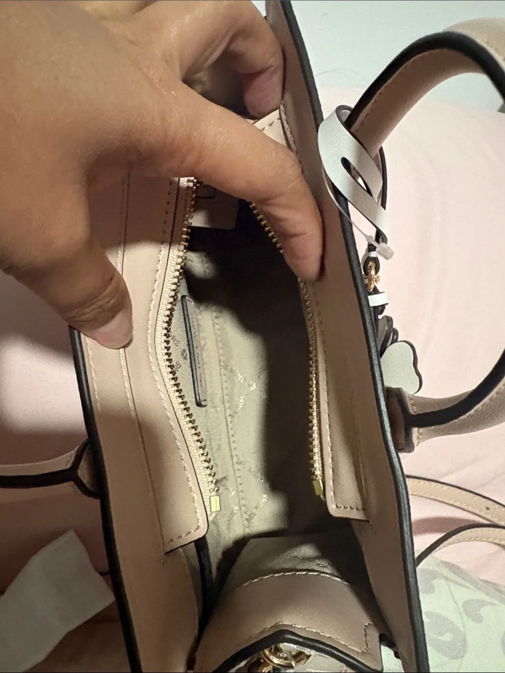 A cute MICHAEL KORS Blush Pink Logo Satchel with Floral Charm